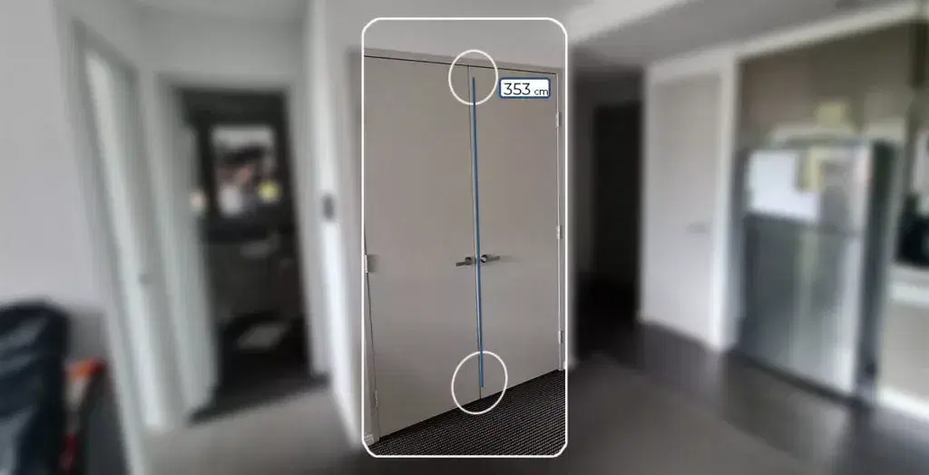 Phone measuring the height of a doorway in AR, showing 353 cm