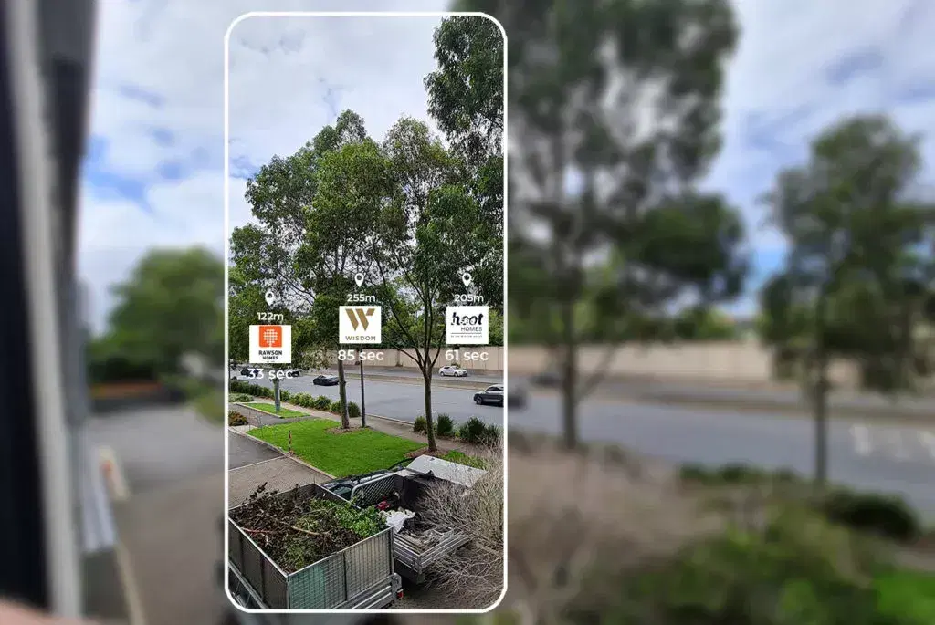 Phone showing an AR street view with distance markers floating over nearby places
