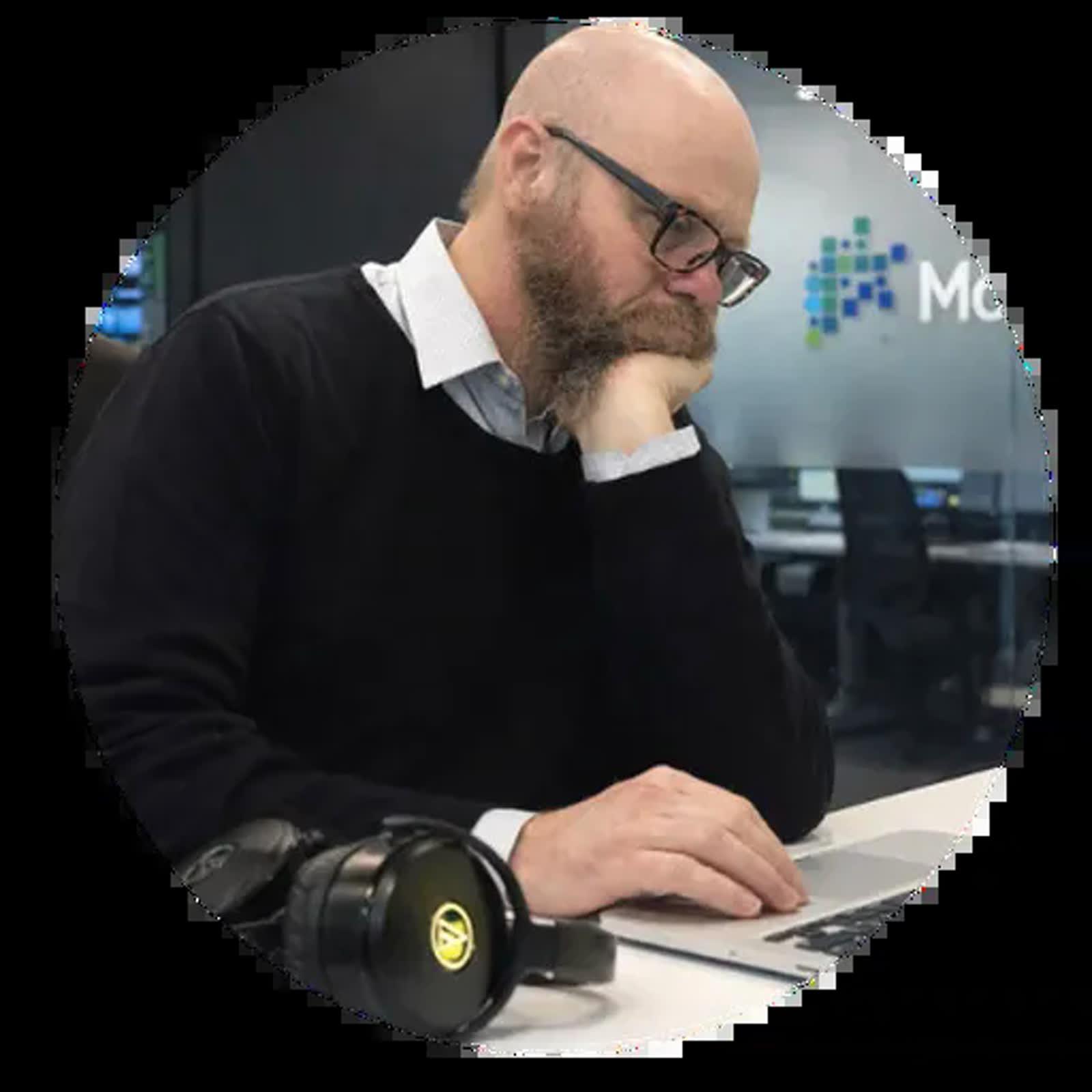 Iain Chalmers working at a laptop