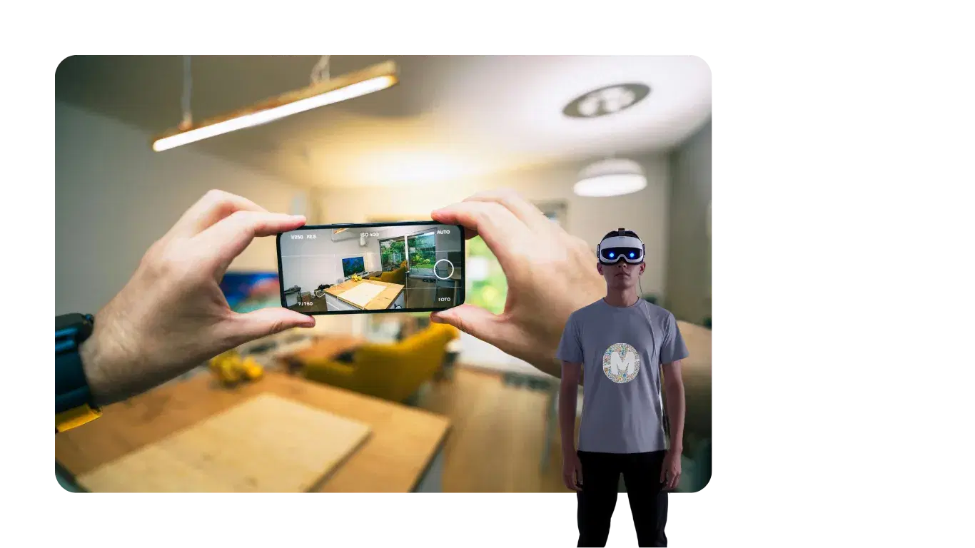 Hands framing a room on a phone camera beside a person wearing a mixed reality headset and a Mobiddiction T-shirt