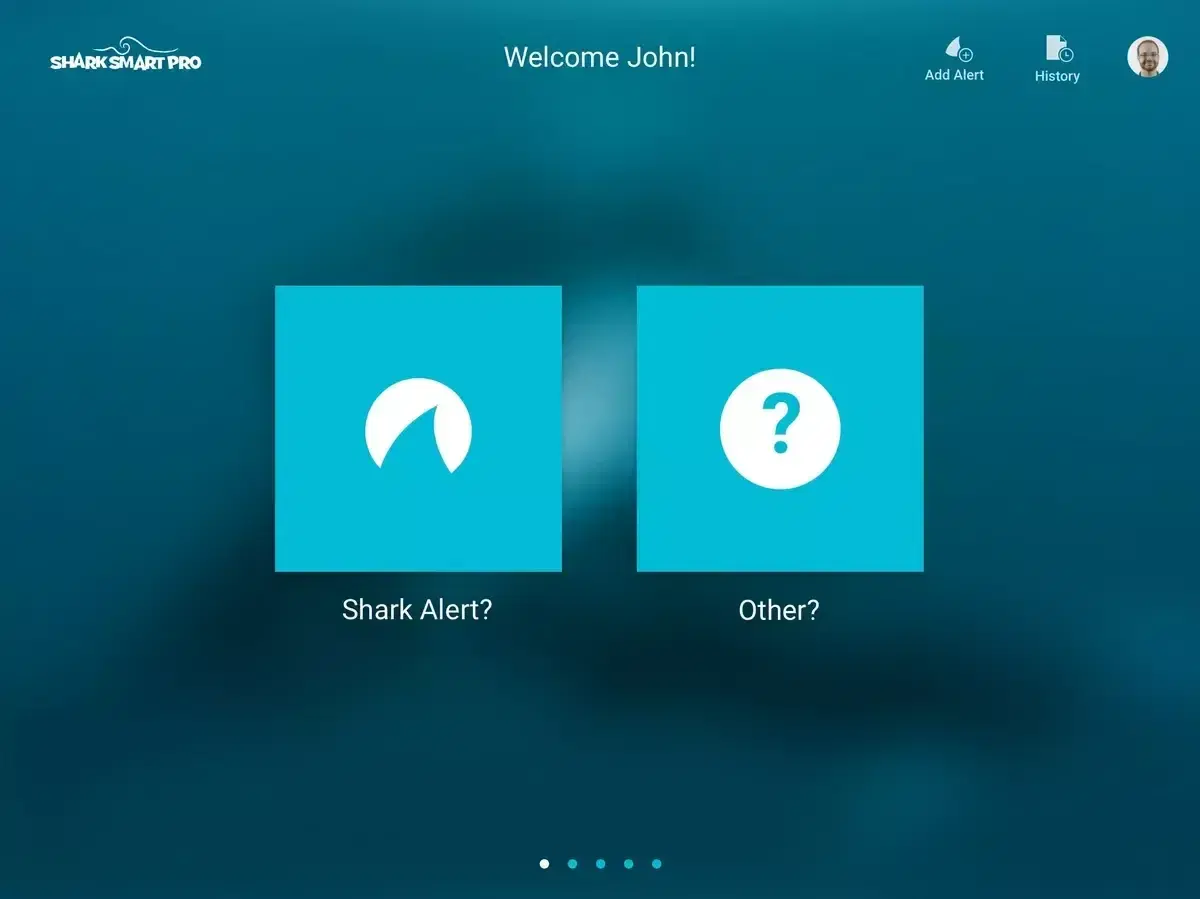 The SharkSmart PRO app on a tablet asking whether to log a shark alert or another type of alert